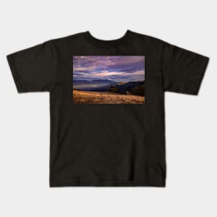 Sunset clouds over mountains Kids T-Shirt